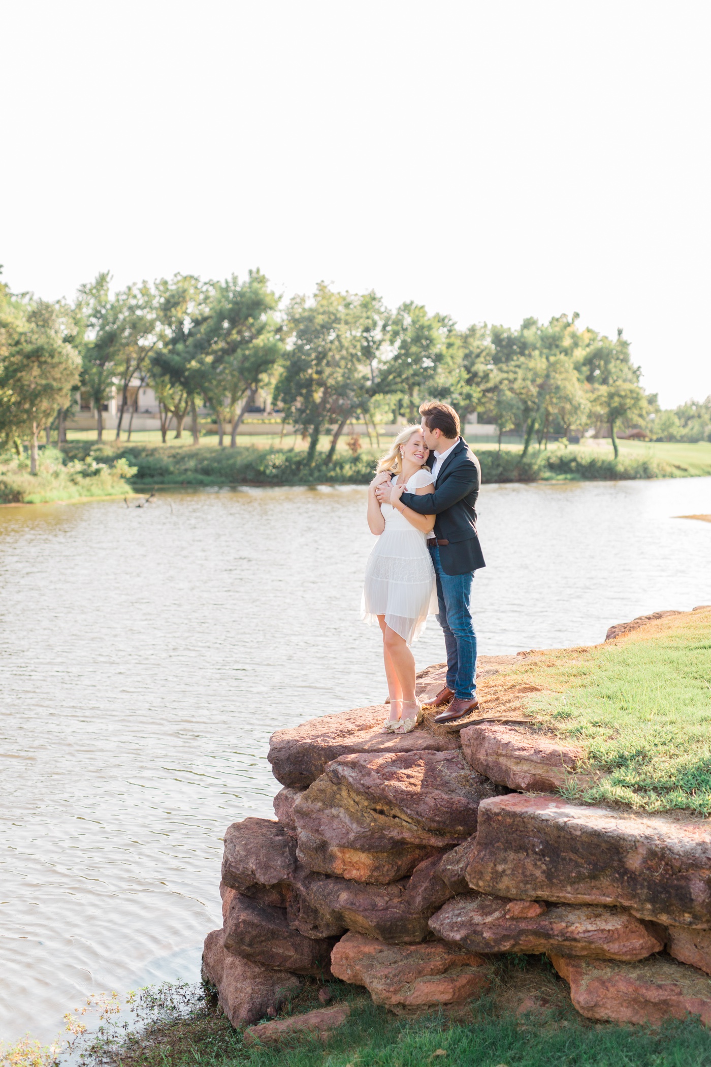 Formal engagement session with a bride in a white dress and gold heels