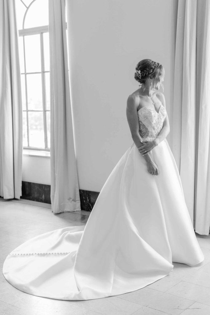Black and white portraits at The Mayo Hotel, with the bride in a satin ballgown by Facchianos