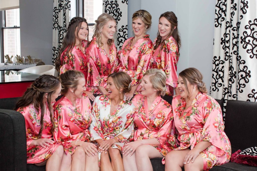 Bridesmaids in floral robes getting ready for a wedding day at The Mayo Hotel