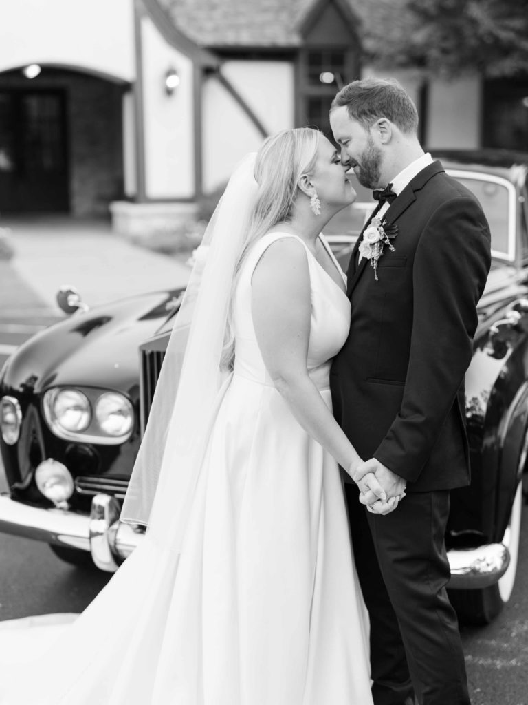 Bride and groom portraits with vintage car in Tulsa