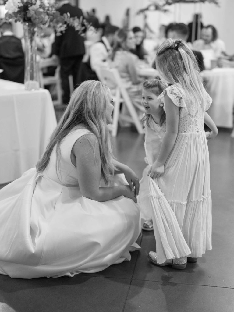 Bride and flower girl at wedding reception at Bella Donna Chapel