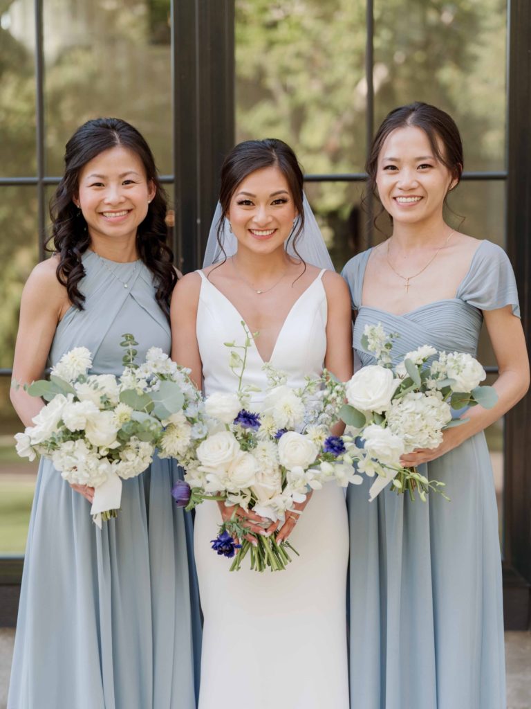 Bridal party with bridesmaids in dusty blue bridesmaids dresses