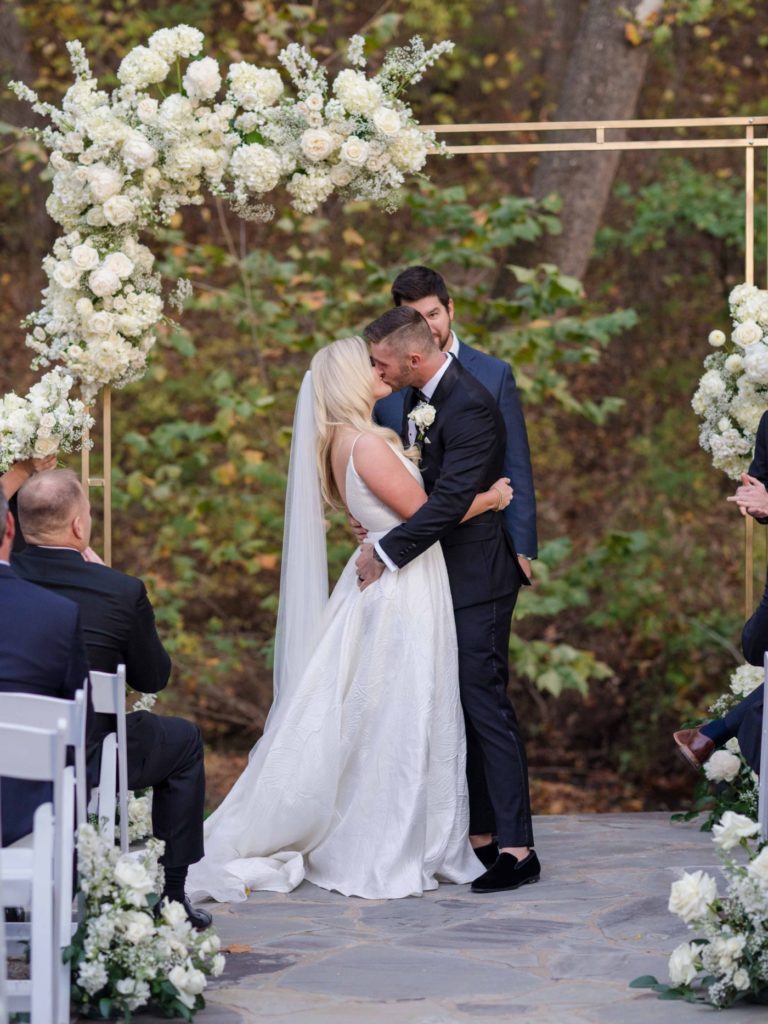 First kiss at wedding ceremony at Spain Ranch