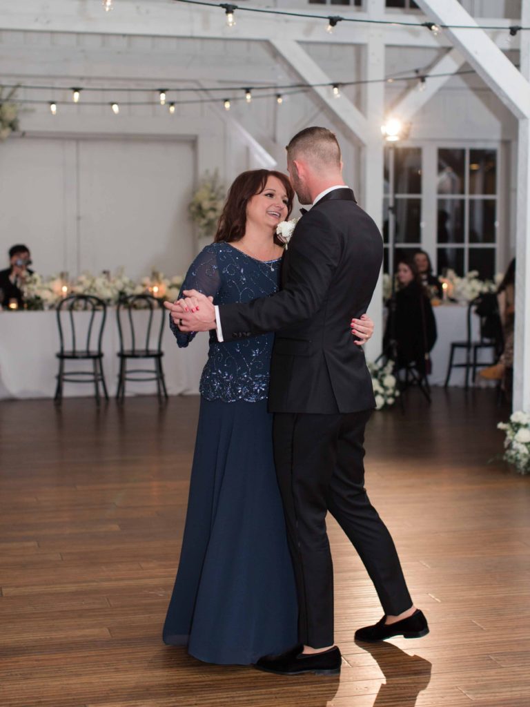 Mother son dance at wedding reception at Spain Ranch
