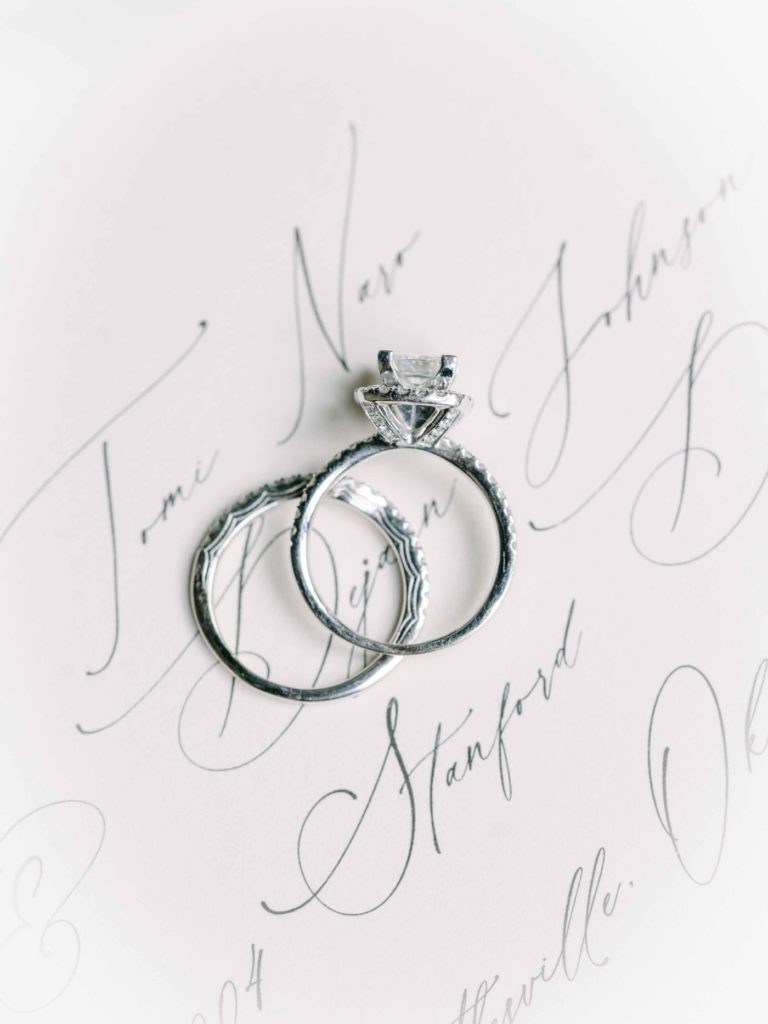 Wedding rings flatlay by Holly Felts Photography