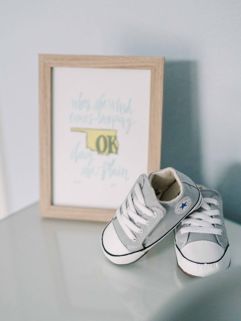 Baby shoes and nursery details during in home newborn session