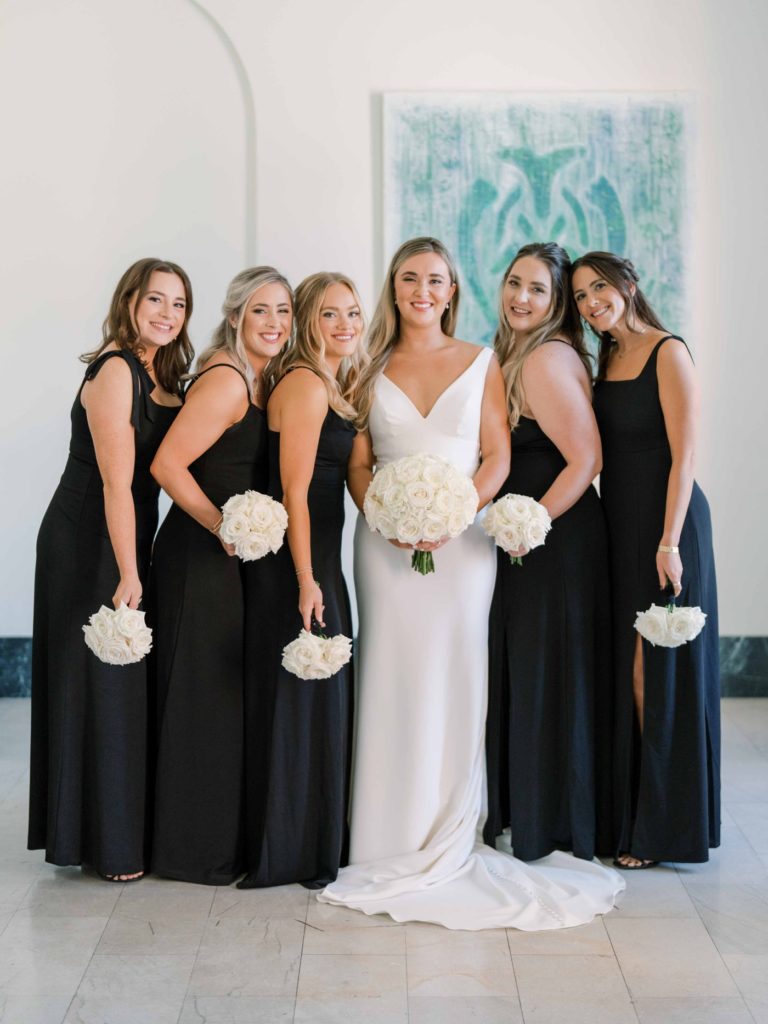 Bridesmaids wearing formal long black gowns for a Tulsa wedding.