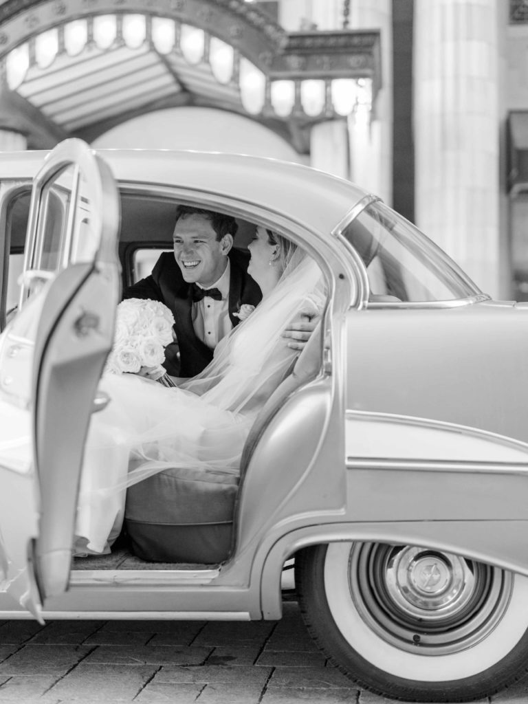 Black and white bride and groom portraits in Tulsa with vintage car