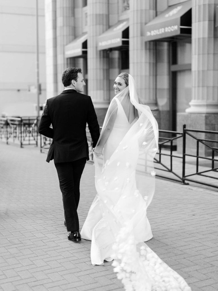 Windy wedding photos with long wedding veil in Tulsa