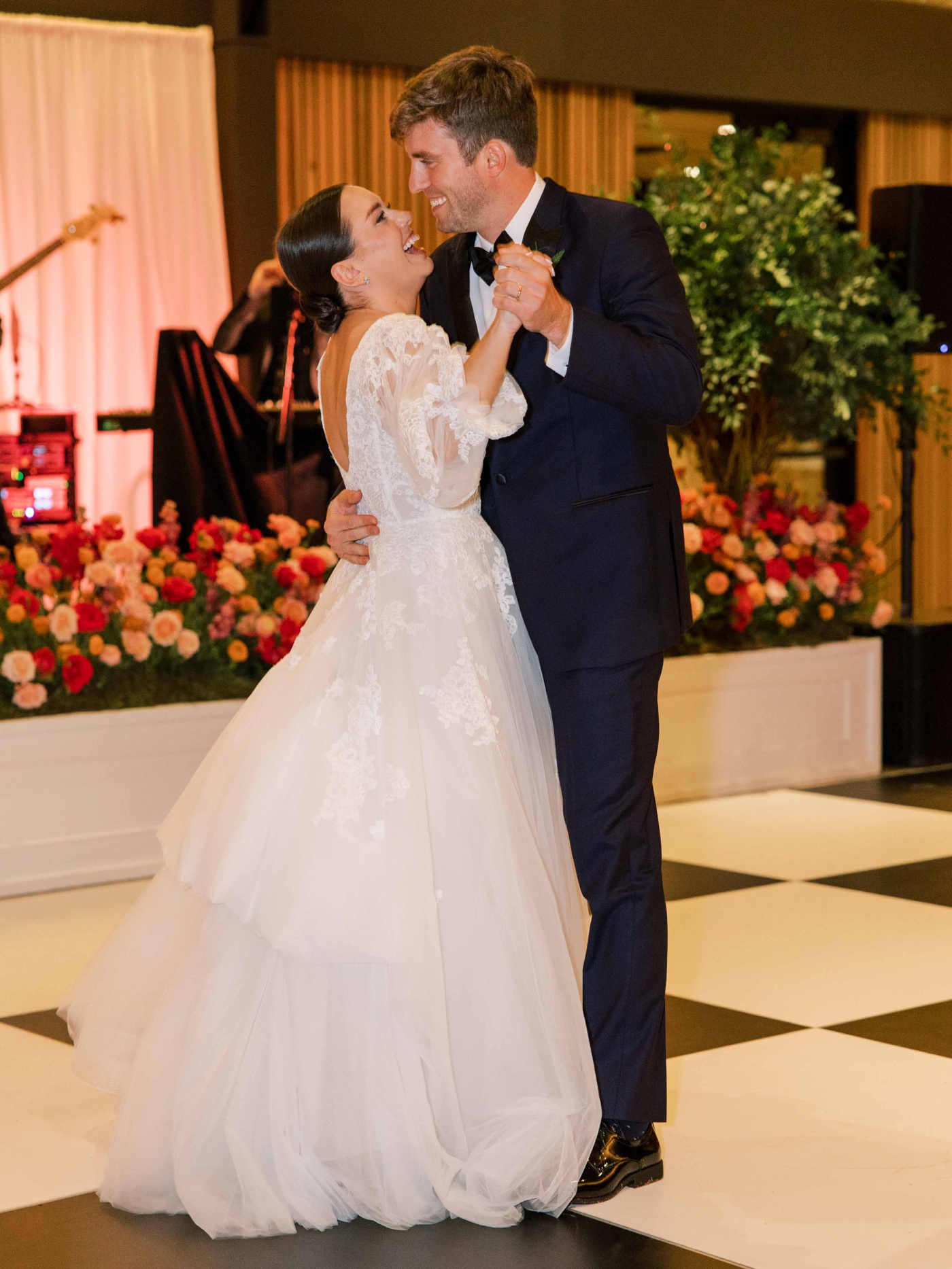 Bride and groom sharing their first dance at their San Antonio Botanical Garden wedding reception