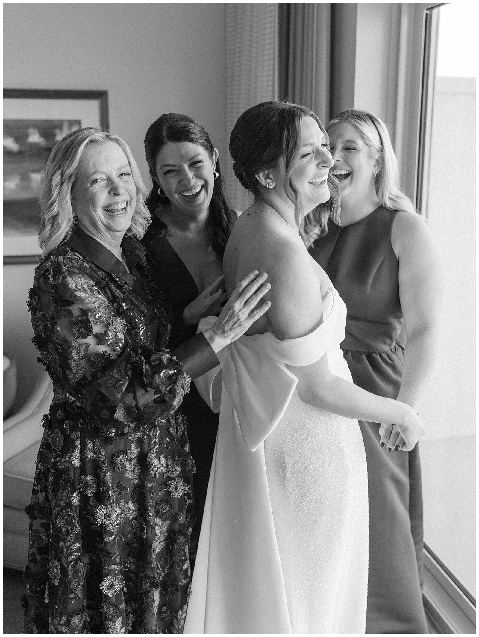 mother and sisters getting ready on wedding day