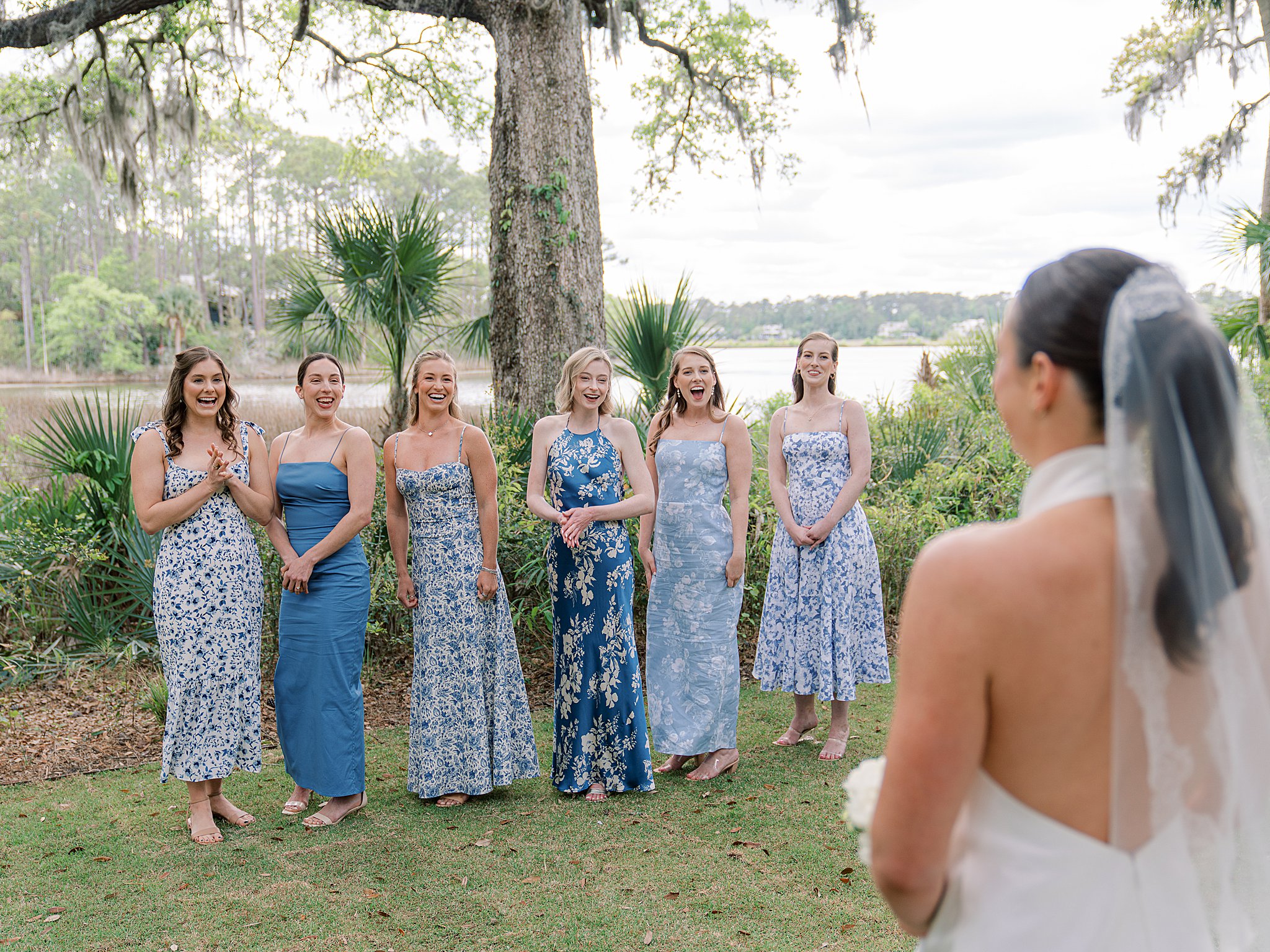 first look with bridesmaids overlooking the marsh on spring island