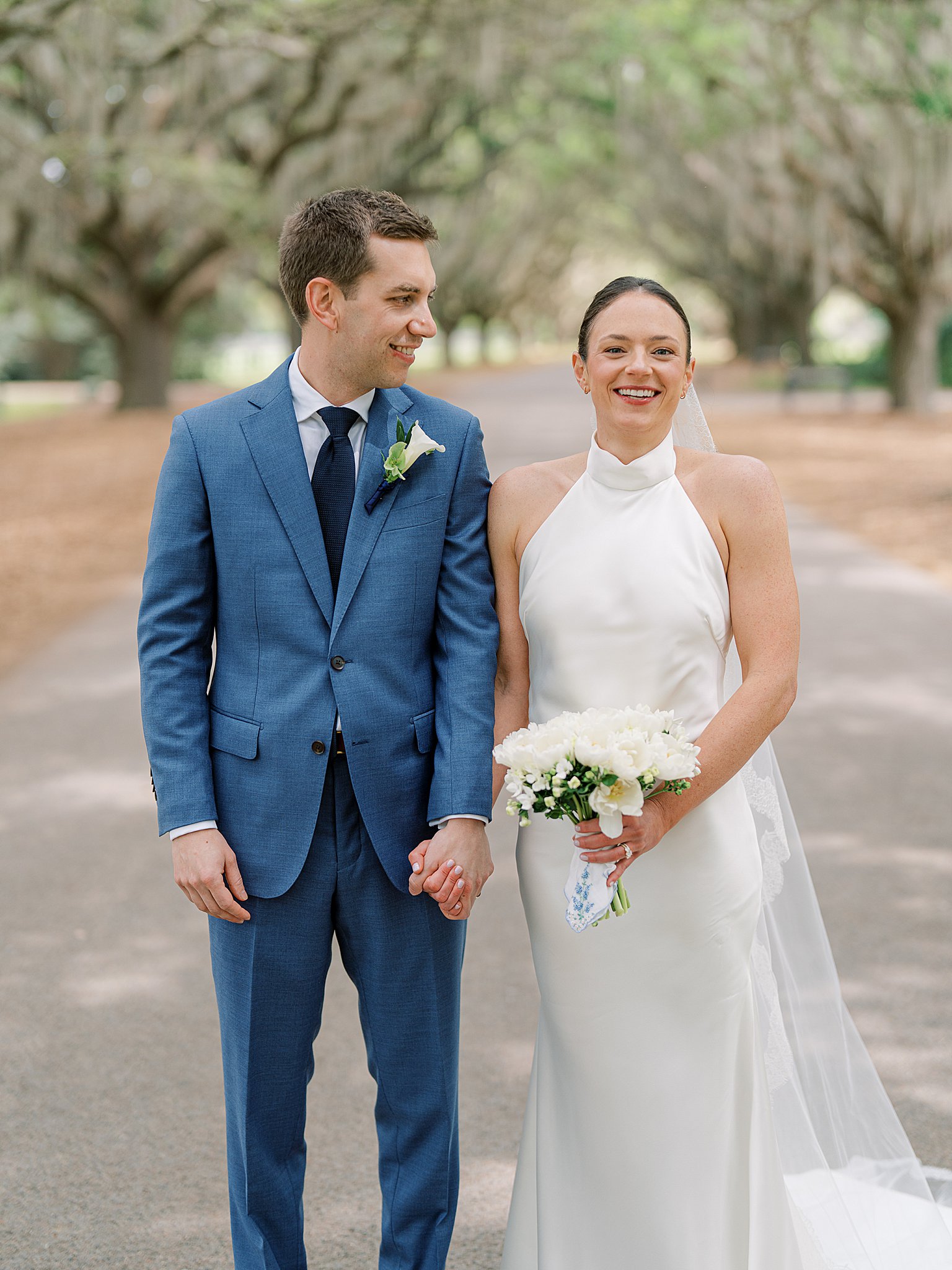 bride and groom on mobley oak lane on spring island wedding