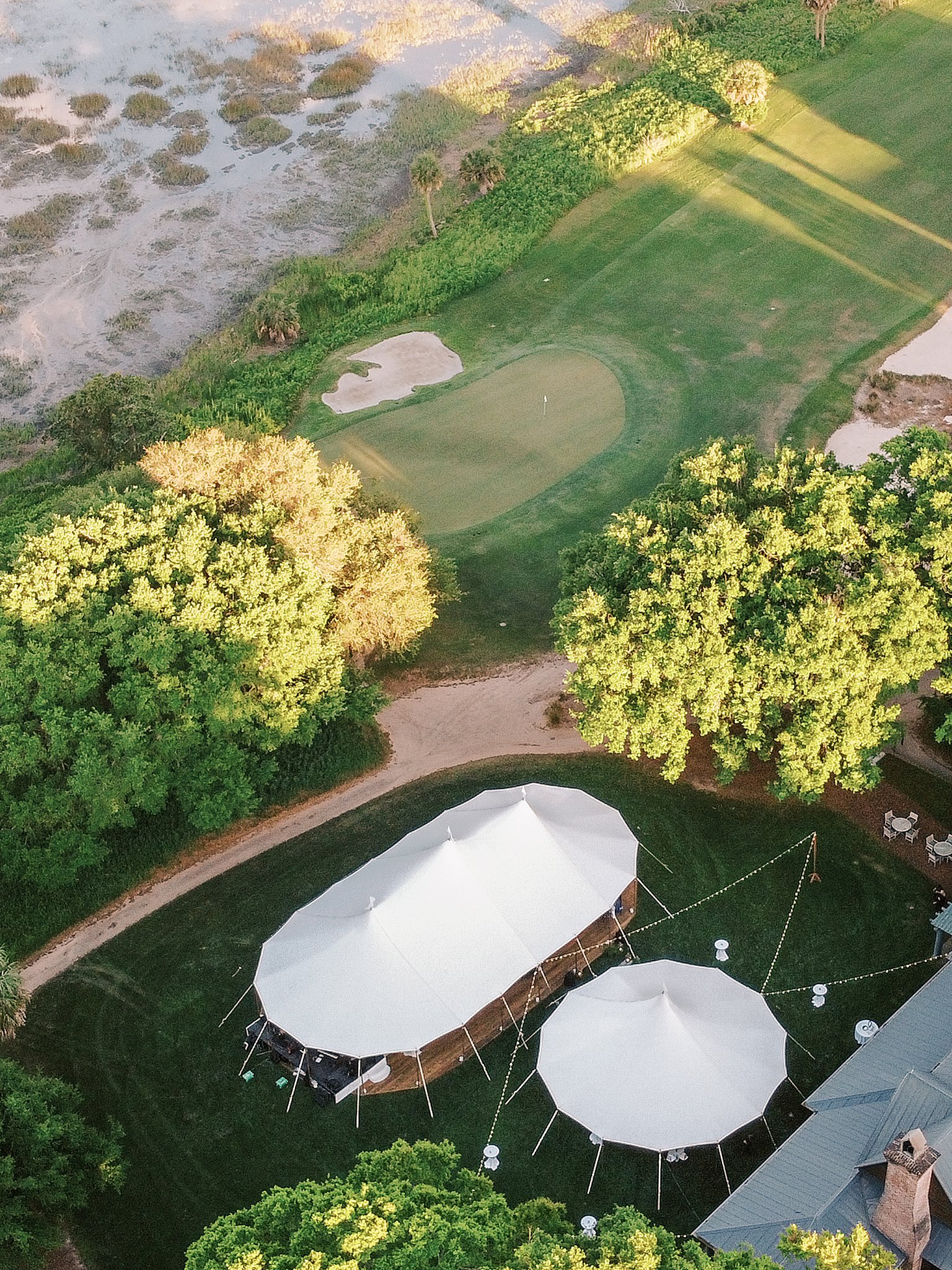 drone photo of reception at spring island wedding over the marsh