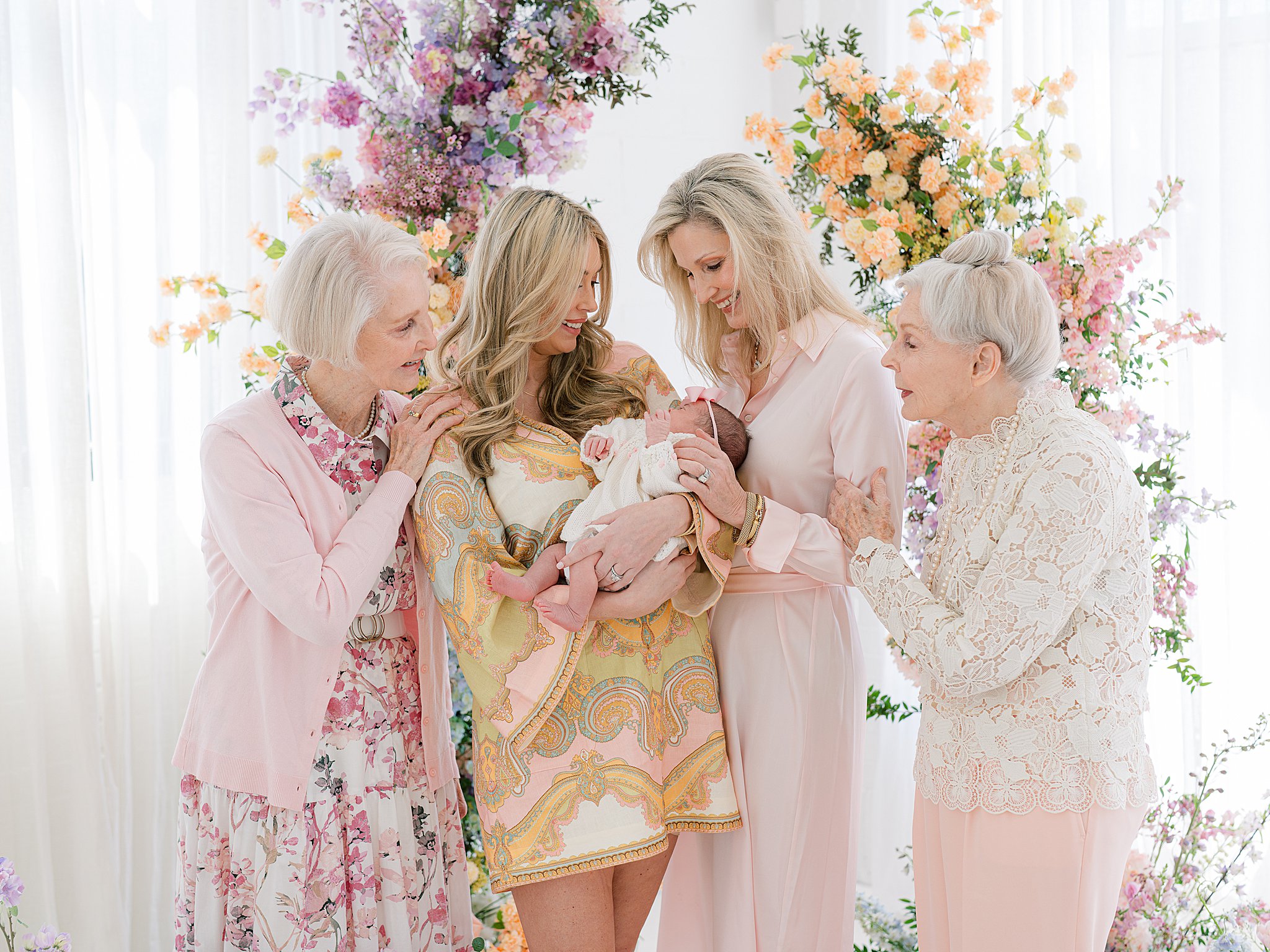 A portrait of five generations of women in one frame, including two grandmothers, a mother, her daughter, and a newborn baby girl during a family photo session in Tulsa, OK.