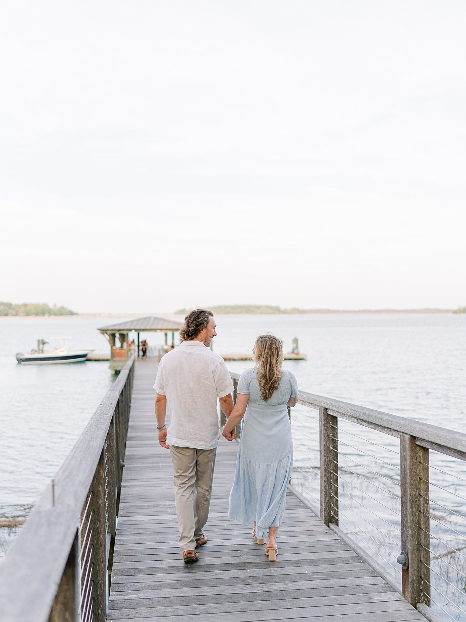 Caitlin in a flowing dress with her baby bump during a dreamy Palmetto Bluff maternity session