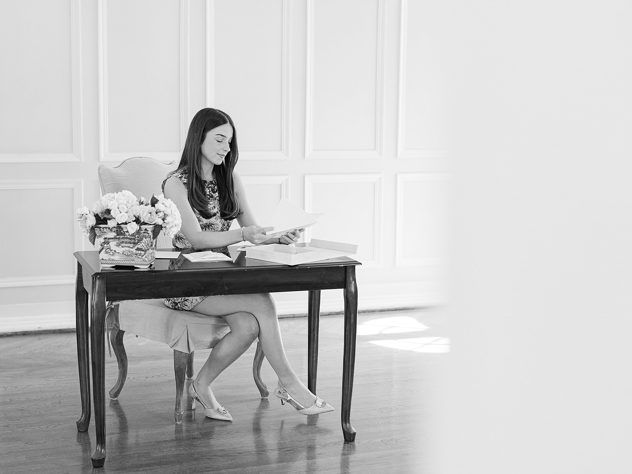 Branding photography of Parlor Paperie founder working at a desk in The Mansion at Woodward Park in Tulsa.