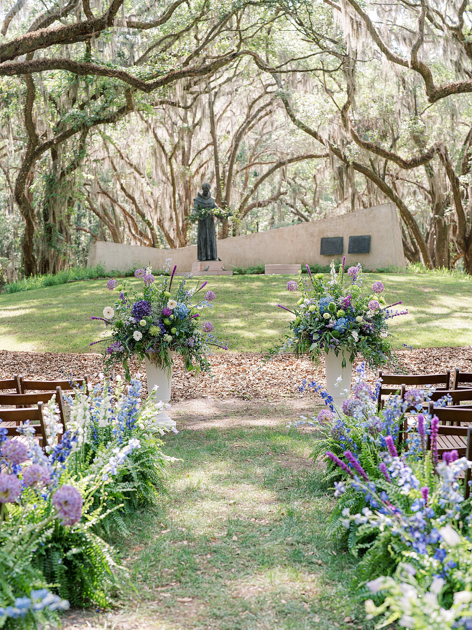 Outdoor wedding ceremony by the marsh on Spring Island photographed by destination wedding photographer Holly Felts.