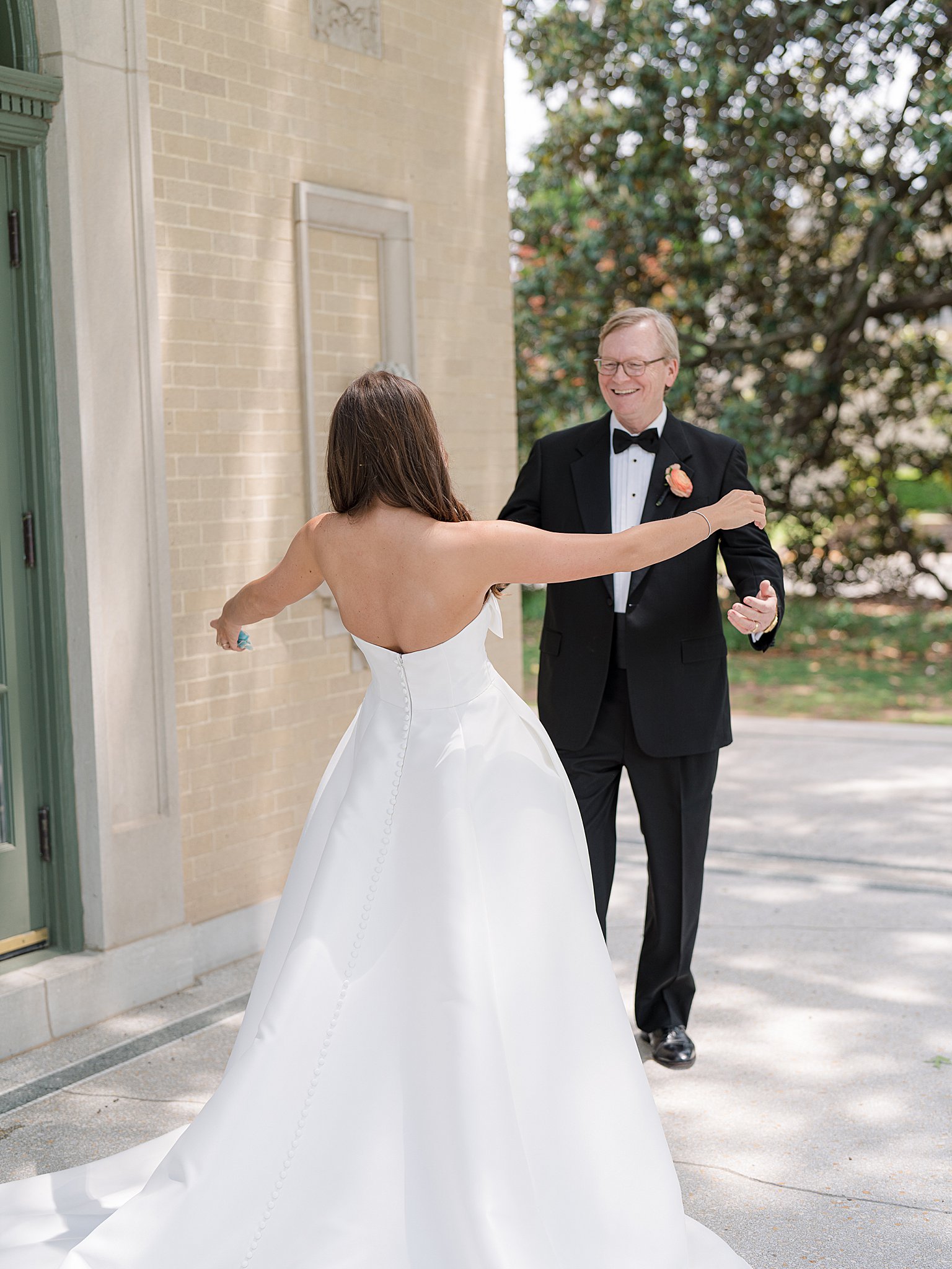 Tulsa wedding photography capturing the emotional father-daughter first look at Chapman and Libby’s wedding