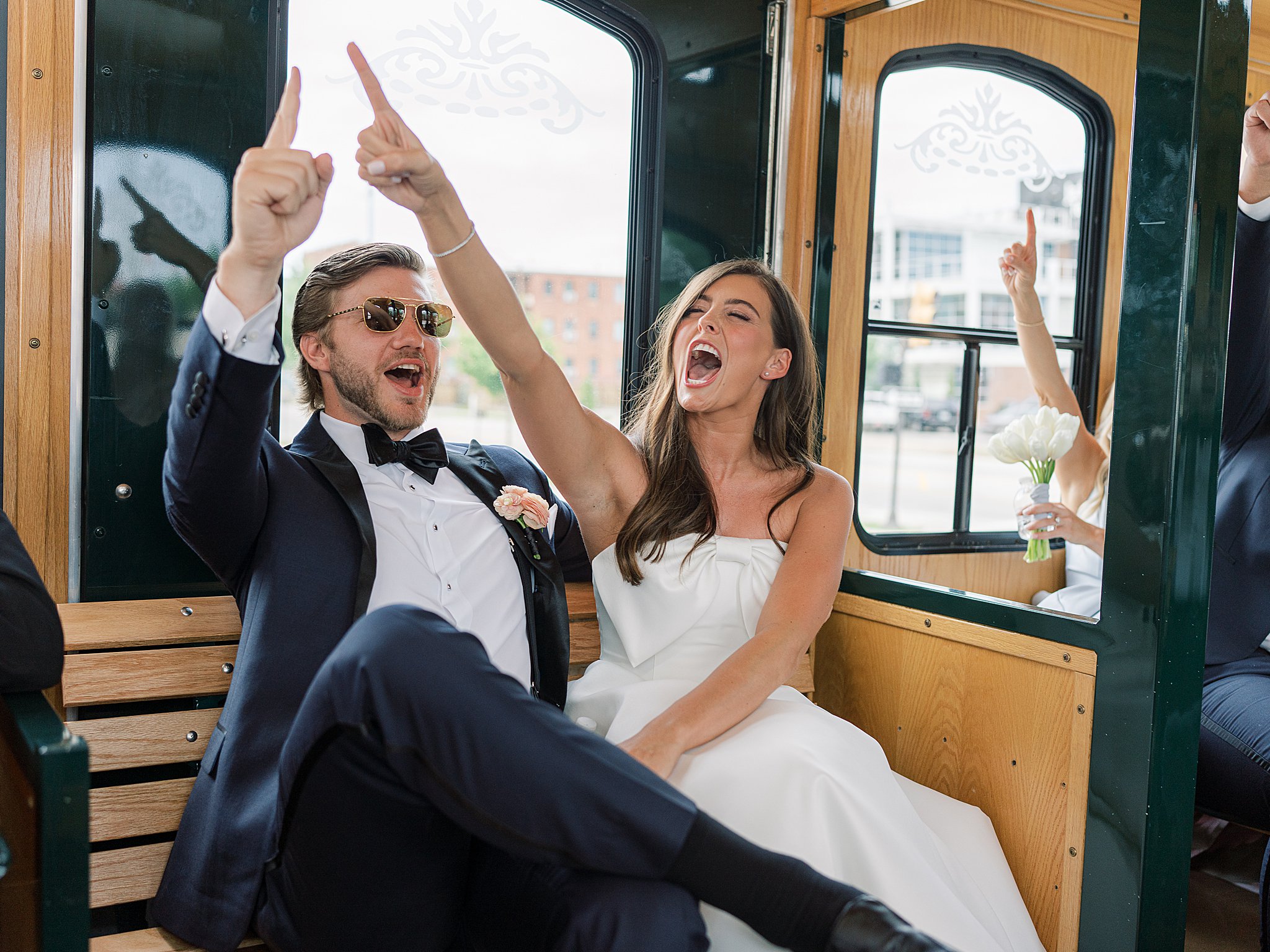 Tulsa wedding photography of Chapman and Libby riding the Old Urban Trolley around downtown Tulsa