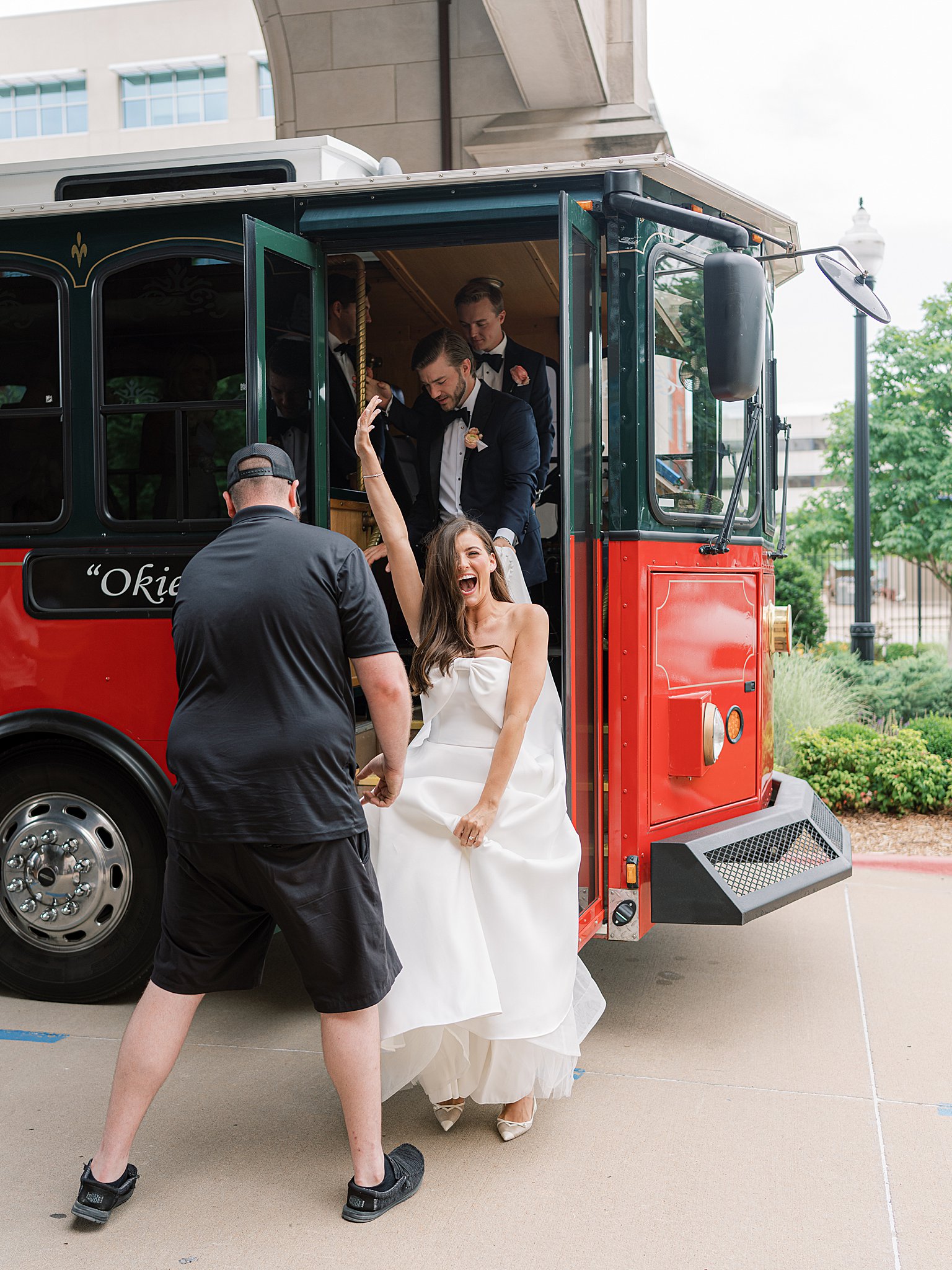 Tulsa wedding photography of Chapman and Libby riding the Old Urban Trolley around downtown Tulsa