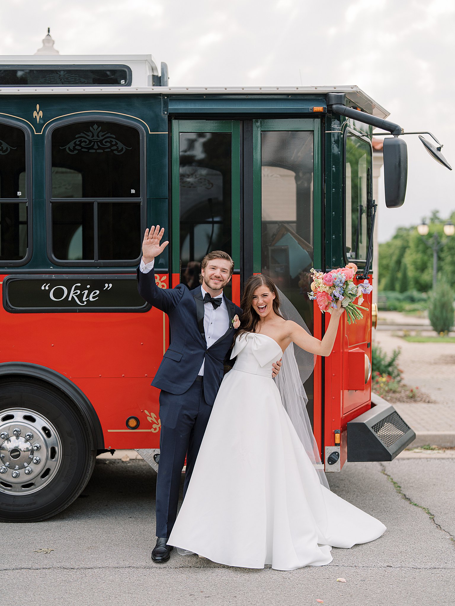 Tulsa wedding couple standing in front of Old Urban Trolley