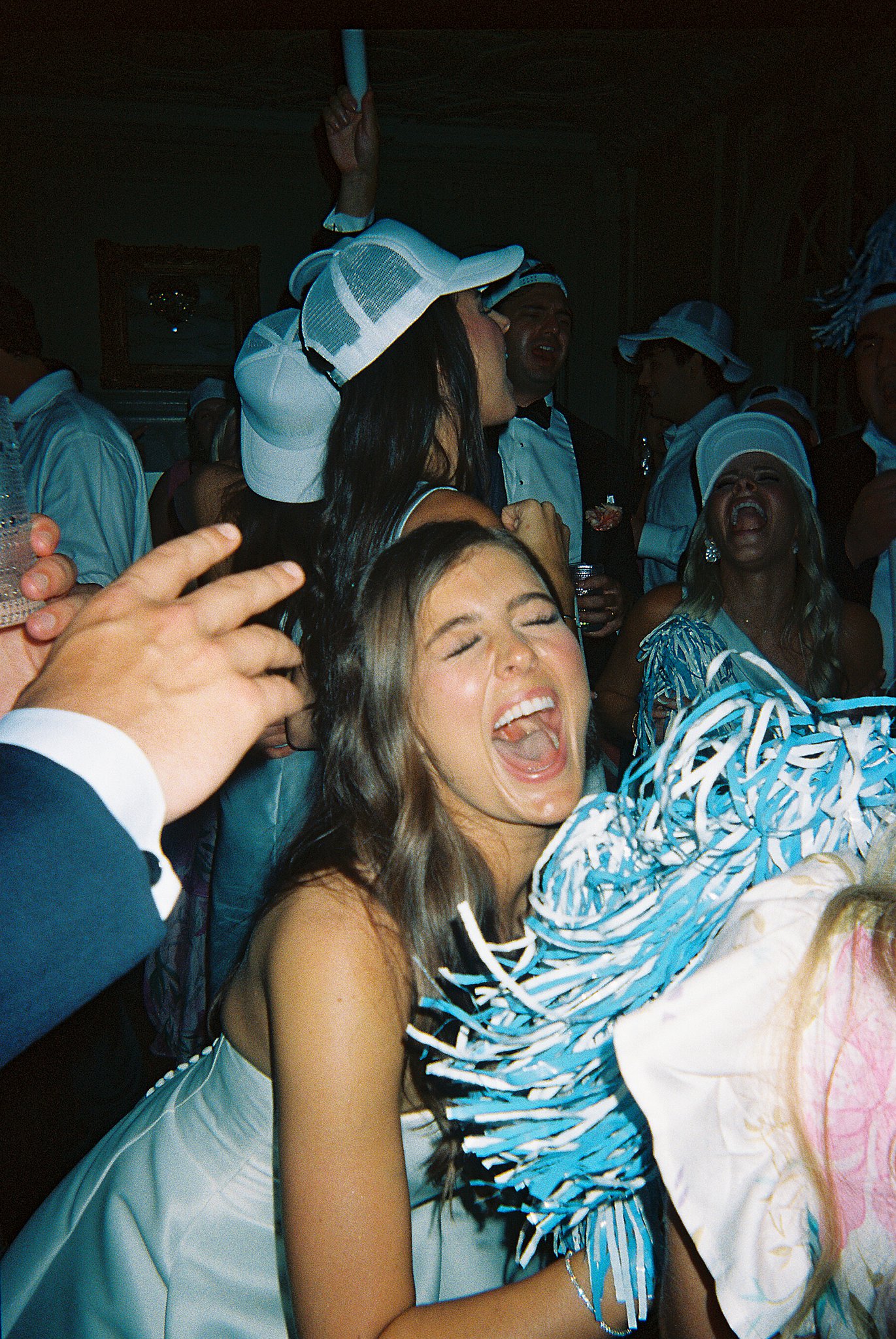 Tulsa wedding photography capturing wedding reception details with guests, decor, and dancing