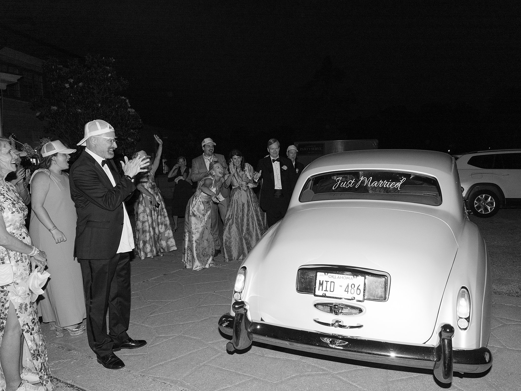 Tulsa wedding photography capturing wedding reception details with guests, decor, and dancing